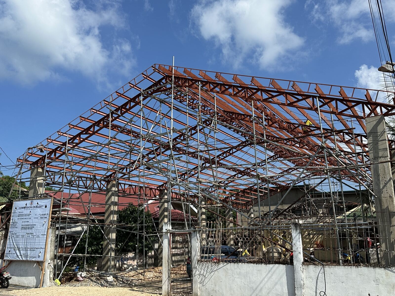 Structural steel roof trusses under construction