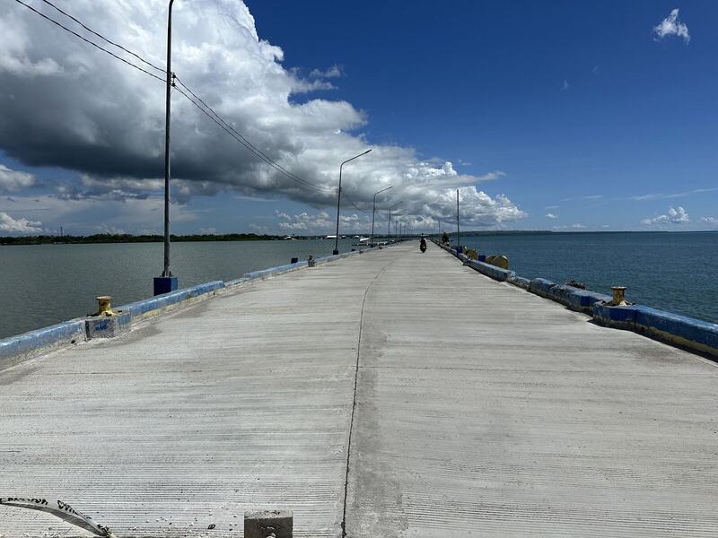Concrete causeway extending over the sea