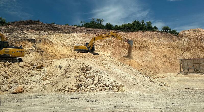 Excavator working at a limestone material site