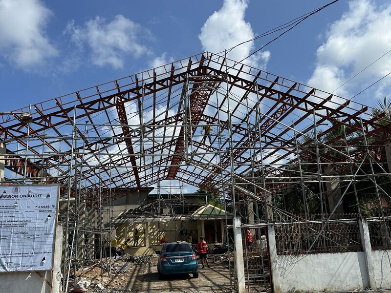 Steel roof trusses erected over a structure